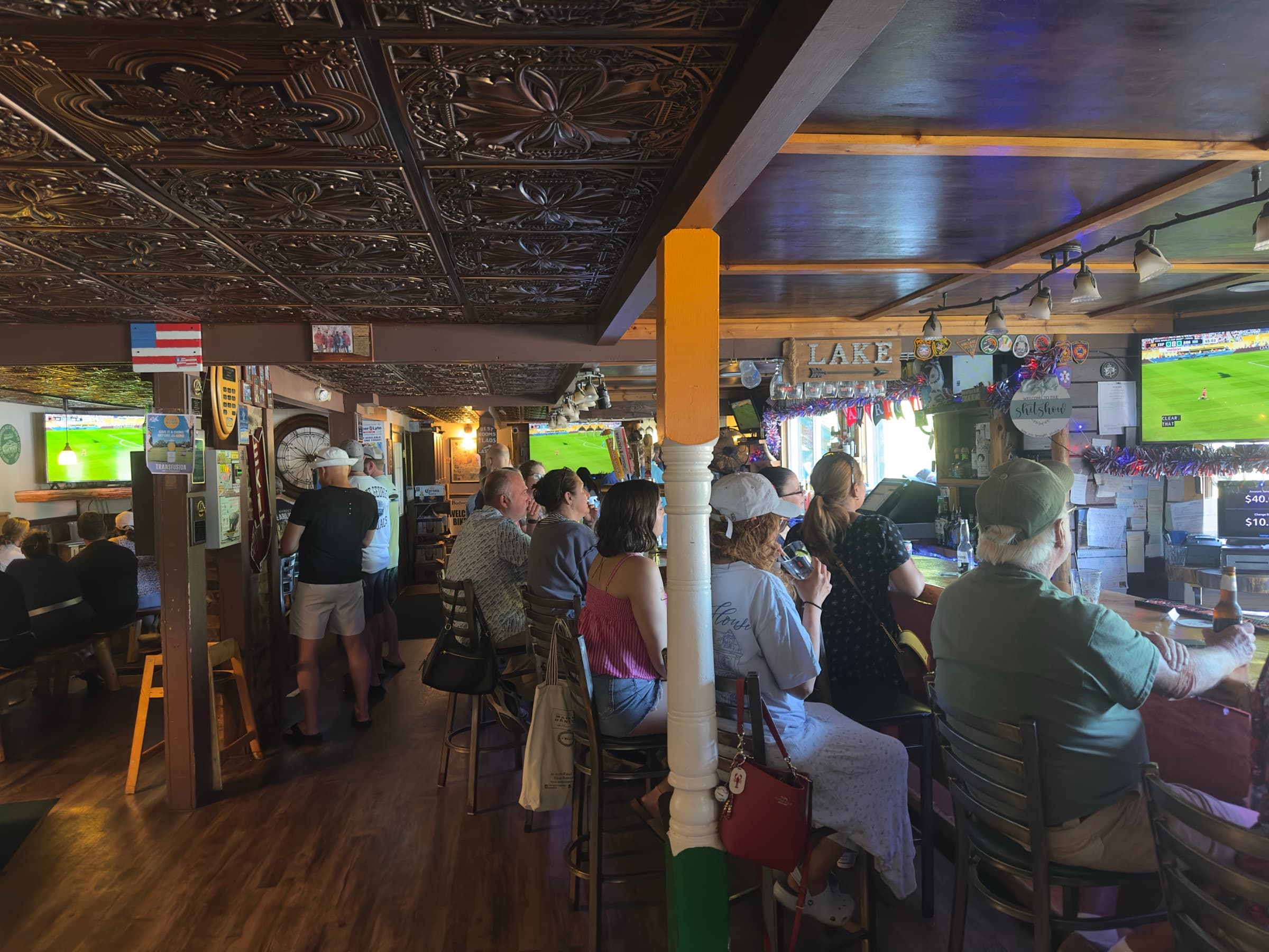 Crowd packed into Duffy's main bar on the first floor, watching the game